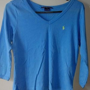 A polo blue long sleeves with a v neck
